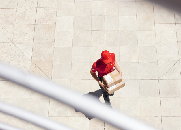 Bird perspective of a driver holding a parcel