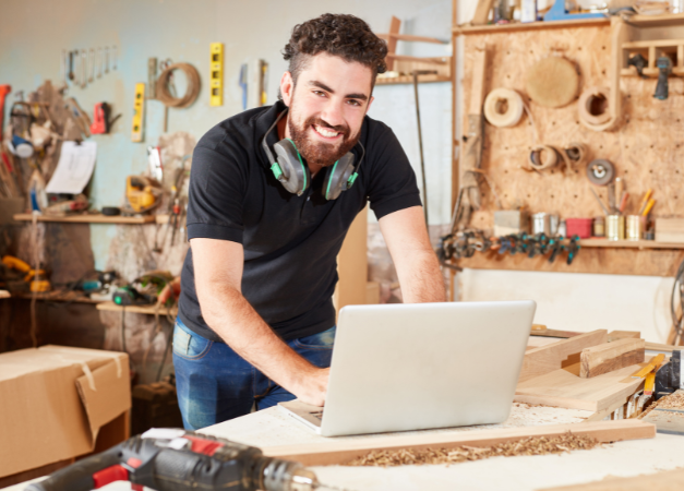 Worker in working at a laptop