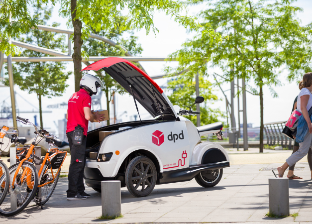 Electric Driver inspecting their electric vehicle