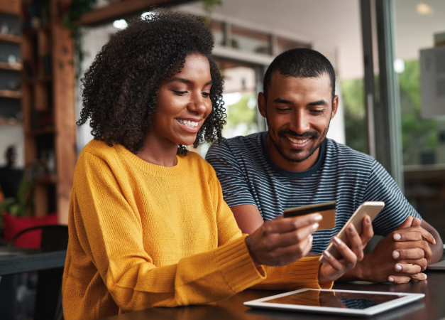 Couple e-shopping on a smartphone